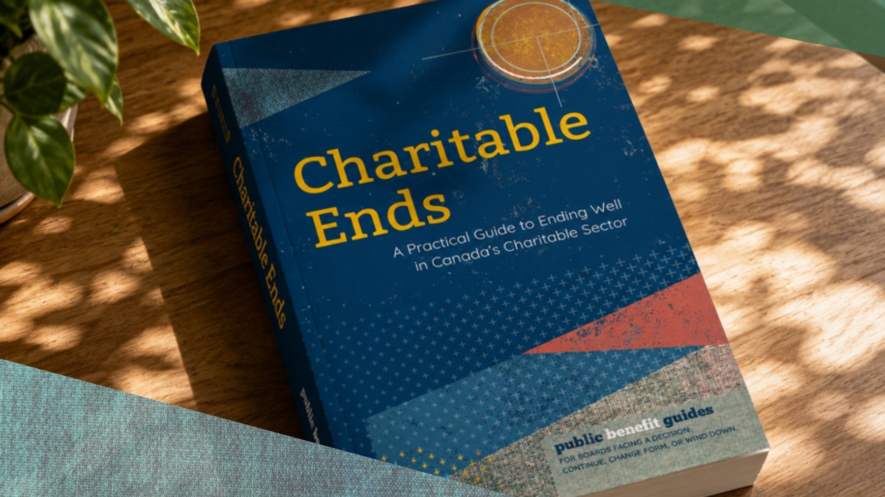 Charitable Ends, the softcover, on a table in afternoon light